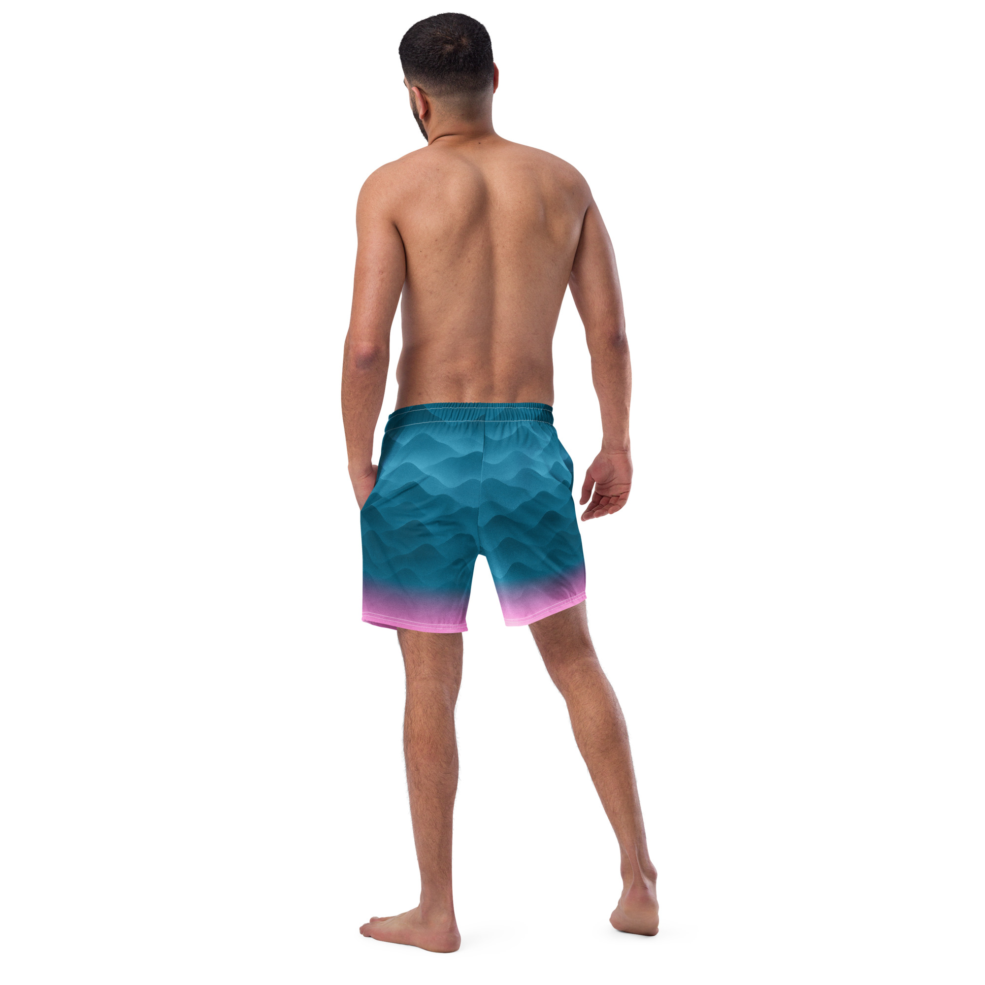 Mann trägt die BERKEI Badehose Fountain Blue mit wellenförmigem Design von hinten.
