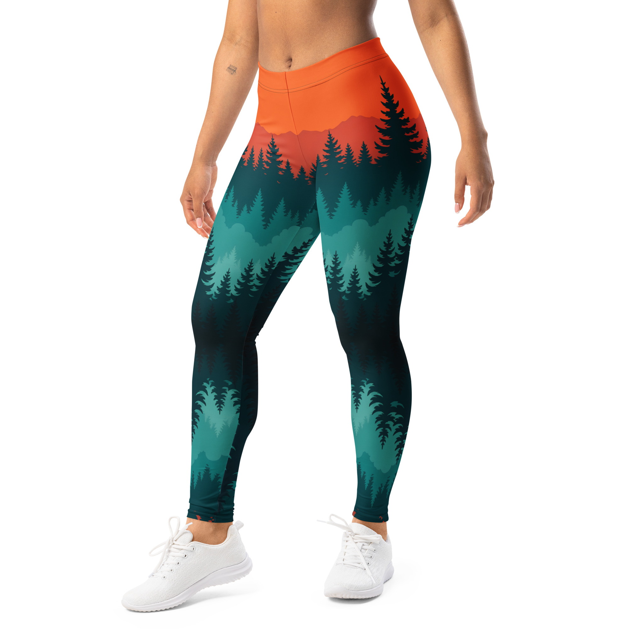 Damen in BERKEI Trail Leggings Taiga Sunset mit buntem Waldmotiv während des Trainings.