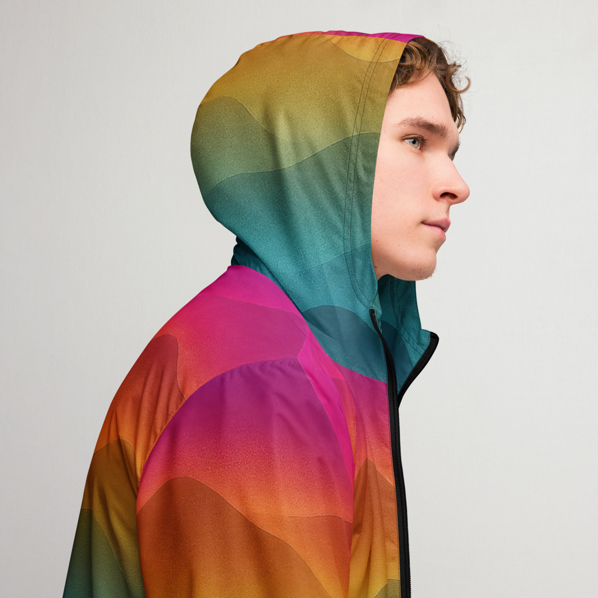 Bunter BERKEI Windbreaker Unisex Forest Sunrise, getragen von einem jungen Mann